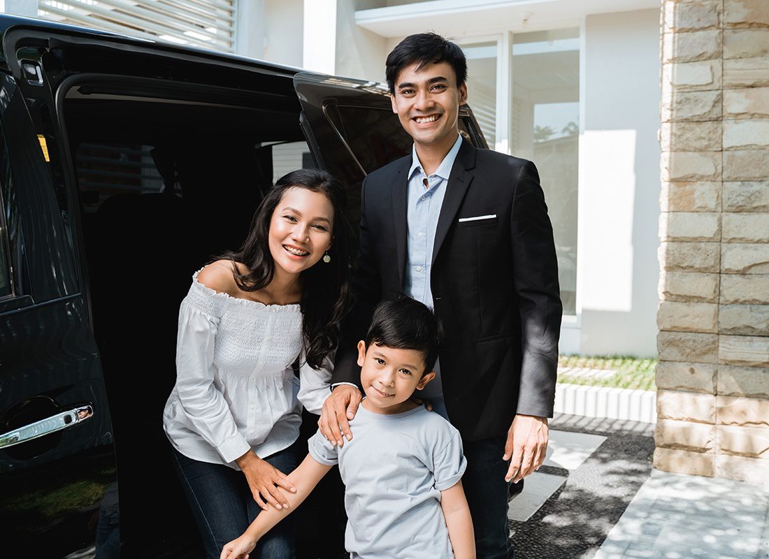 Personal Insurance - Happy Family Preparing to Leave the House and Drive in Their Car